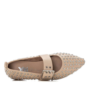 Beige flat shoe with rhinestone embellishments on a white background