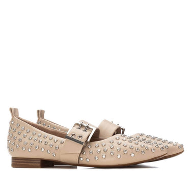 Beige loafers with crystal embellishments on a white background