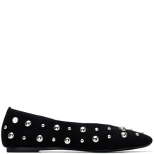 Black flat shoe with silver studded details on a white background