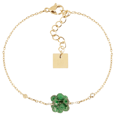 Gold bracelet with green gemstones on a white background