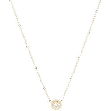 Gold necklace with a small round pendant on a white background