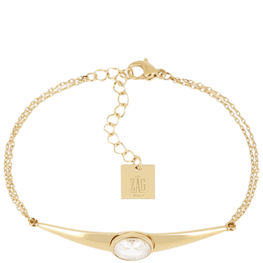 Gold bracelet with a clear gemstone and 'ZAG' tag on a white background