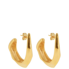 Gold hoop earrings on a white background