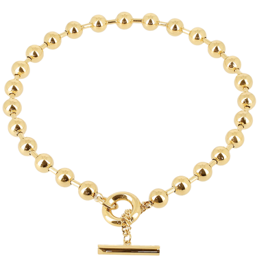 Gold beaded bracelet with a clasp on a white background