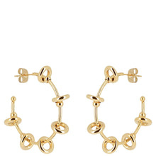 Gold hoop earrings on a white background