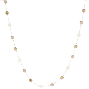 String of round beads in gold and silver on a white background