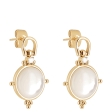 Gold earrings with white stones on a white background