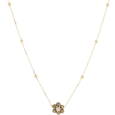 Gold necklace with a floral pendant on a white background