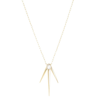 Gold necklace with a central gemstone on a white background